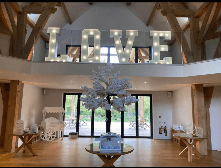 LOVE letters displayed in a barn wedding venue