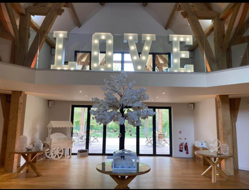 Illuminated LOVE letters at a wedding venue