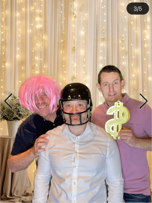 Guests enjoying photo booth at a party